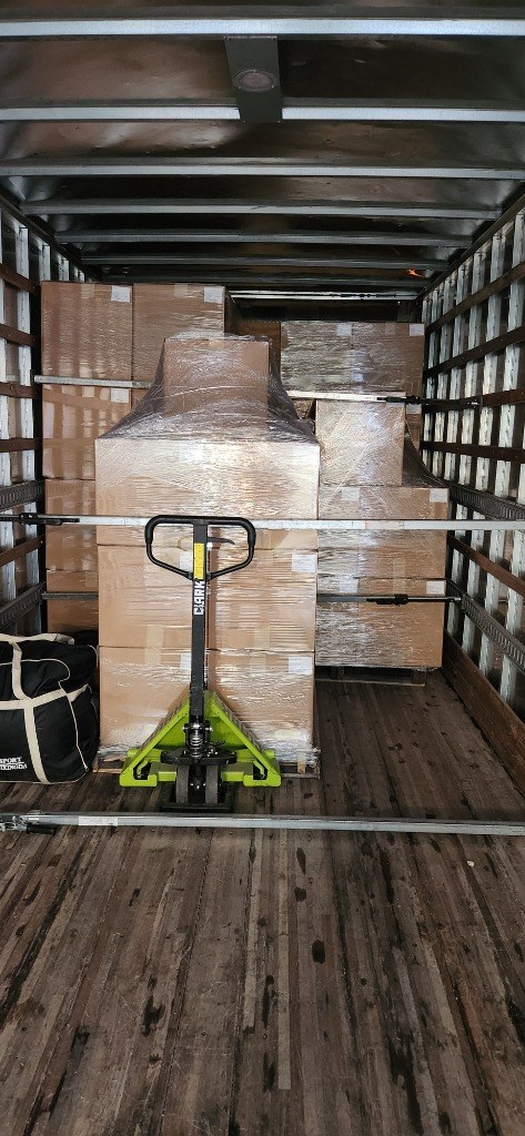 High-Volume Stacked Pallets Secured with Multi-Level E-Track Load Bars